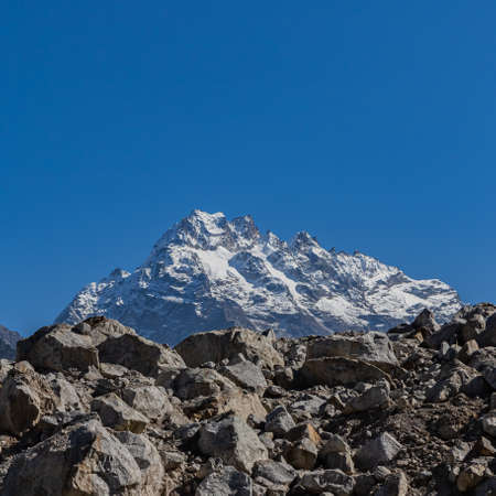 A postcard image of a majestic peak with blue sky on the horizon on the Tibetan plateau of Sikkim Indiaの写真素材