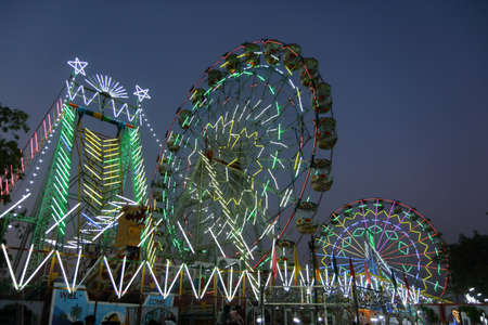 High dynamic range Selective focus image of Giant wheels at Pushkar Camel fair at Rajasthan, India on 20 October 2017のeditorial素材