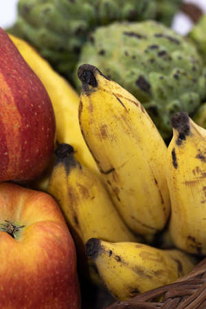 Close up of red Apples, Bananas and custard applesの写真素材