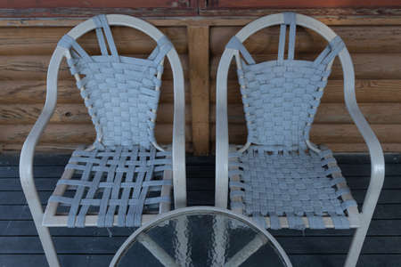 Abstract Selective focus image of a glass table and chairs depicting shapes of furnitureの写真素材
