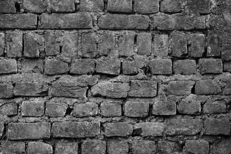 An old brick wall with patters as an  Abstract in black and whiteの写真素材