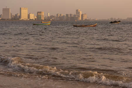 A view of the Mumbai skyline of Nariman point from marine drive beach at Mumbai India on 2 April 2021のeditorial素材