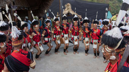 Tribal Men from Nagaland performing their traditional dance during Hornbill Festival in a village in Nagaland India on 1 December 2016のeditorial素材