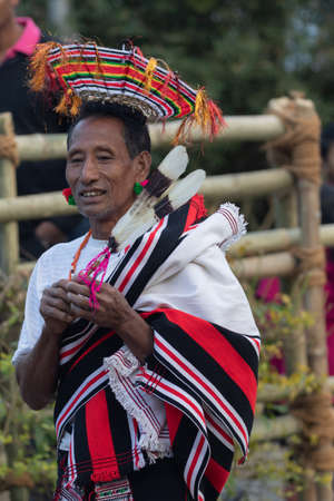Standing Portrait of a Naga tribesman dressed in traditional attire at Kohima Nagaland India on 4 December 2016のeditorial素材