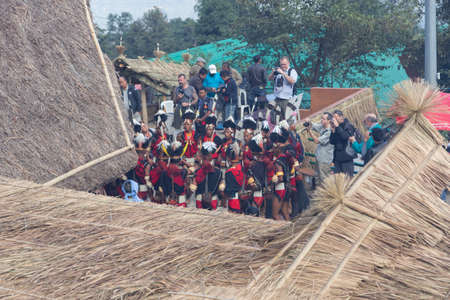 Selective focus image of Traditional dance being performed by tribal men of Nagaland and being...