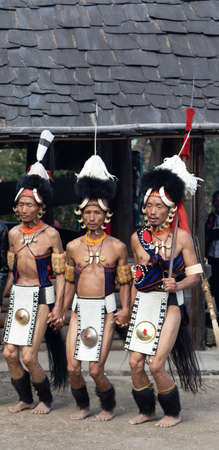 Selective focus image of Traditional dance of Nagaland being performed by Naga tribesmen in their traditional attire during Hornbill Festival in Nagaland India on 1 December 2916のeditorial素材