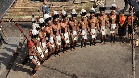 Selective focus image of Traditional dance of Nagaland being performed by Naga tribesmen in their traditional attire during Hornbill Festival in Nagaland India on 1 December 2916のeditorial素材