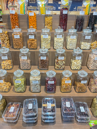 Variety of dry fruits neatly displayed in Glass Jars on Shelves of a supermarket in Pune India on 3 August 2021のeditorial素材