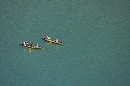 Ariel view of Tourists siting on row boats in a lake at Nainital India on 2 January 2022のeditorial素材