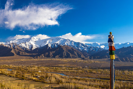 Prayer flags on the background of mountains and blue sky.の写真素材