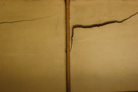 Old paper with cracks and scratches. Abstract background and texture for design.の写真素材