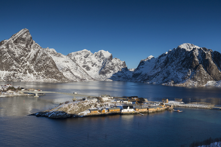 Aerial view on Sakrisoya village with rorbuer, mountains, fjordの写真素材