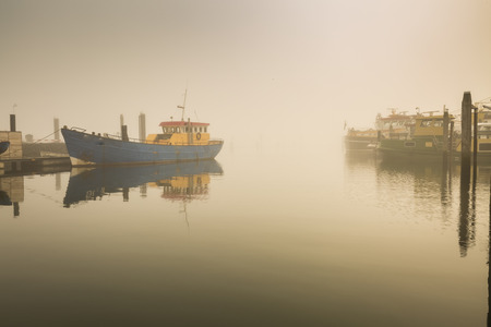 Fishing boats awaiting delayed departure in the harbour of Bruinisse, Zeeland, due to heavy fog...