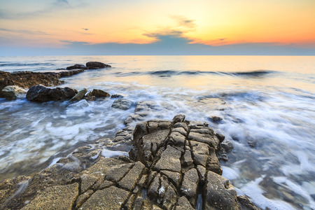 Colorful sunset on a beach with rocks on the Adriatic Sea coast Istria Croatia