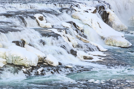 Gullfoss waterfalls located along the golden circle route, Iceland during Winter season. Ice, snow, water and sunset.の写真素材