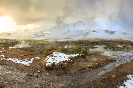 Geothermal landscape Strokkur Geysir in Winter. Located on the Golden circle, Geyir is a popular attraction for tourists.の写真素材