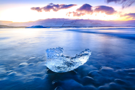 Jokulsarlon glacier lake in Iceland during sunset in Winter season. The lake is growing every year...