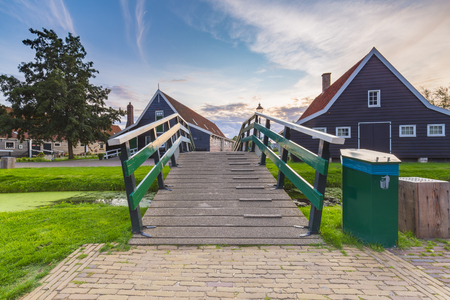 Typically traditional Dutch house, historical architecture and bridge over water at the Zaanse Schans, Amsterdam. Attractive landmark.の写真素材