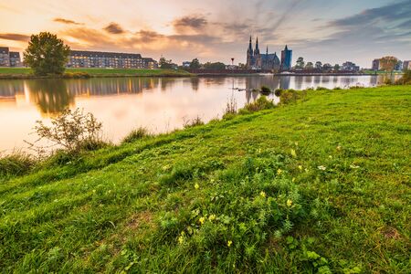 Land van Cuijk, agricultural landscape at the small village Cuijk and the Meuse river, the Netherlands under a blue sky. Popular touristic landmark for travelの写真素材
