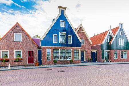 Old streets in Volendam. Old traditional fishing village, typical wooden houses architecture. Popular landmark and travel destination for tourists.の写真素材