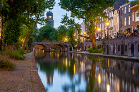 Traditional dutch houses, streets and bridges during dusk. Oudegracht canal, Utrecht city center. High Dynamic Range HDR imageの写真素材