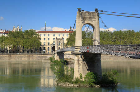 Monumental Passerelle du College bridge over Rhone river in Lyon, France, on a spring day.の写真素材