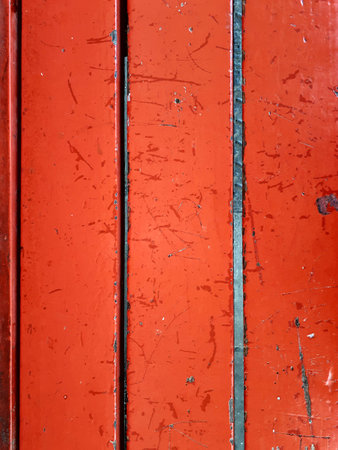 old red wooden planks weathered from a benchの写真素材