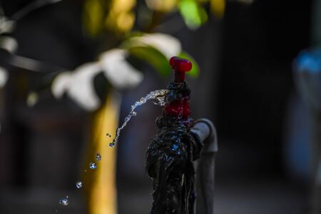 Water is coming out of the water tap.の写真素材