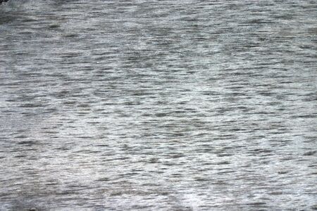 a fragment of the surface of an old wooden boardの写真素材