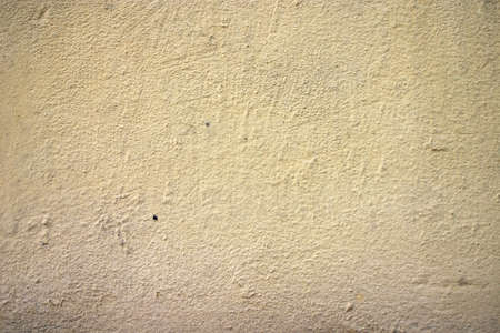 Texture of old yellow paint on a small area of the surfaceの写真素材