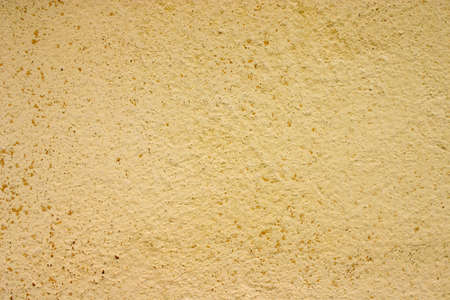 Texture of old yellow paint on a small area of the surfaceの写真素材
