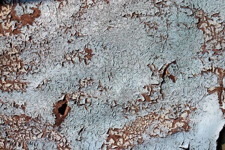 Texture of rusty metal, partially covered with an old blue paintの写真素材