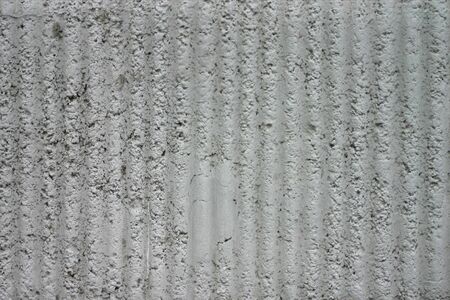 texture of gray rough plaster on the wall surfaceの写真素材