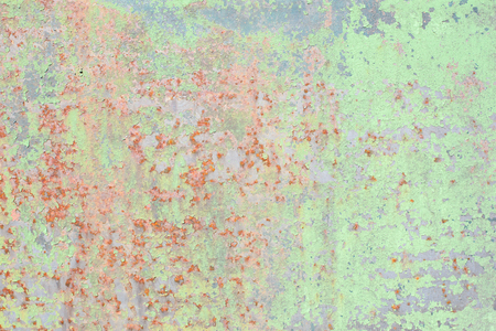 Texture of rusty metal, partially covered with an old green paintの写真素材