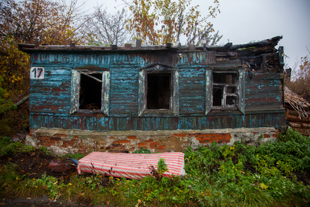 facade of the old building collapsing Russian peasant houseの写真素材