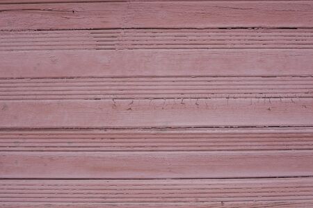 texture of cracked paint on the wooden surface of the old houseの写真素材