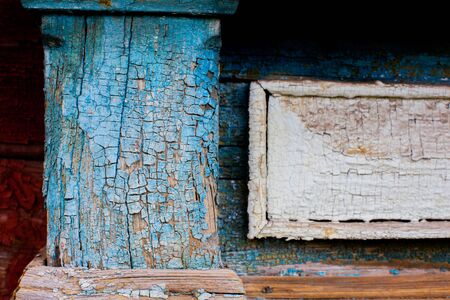 texture of cracked paint on the wooden surface of the old houseの写真素材