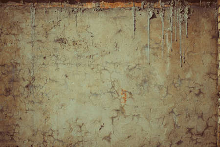 Plaster on the wall with cracksの写真素材