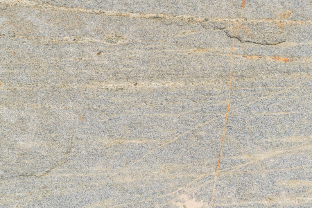 Rough texture of the stone surface of an ancient boulder.の写真素材