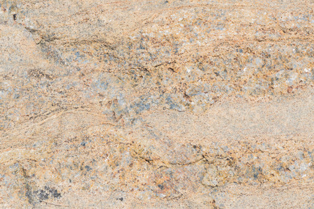 Rough texture of the stone surface of an ancient boulder.の写真素材