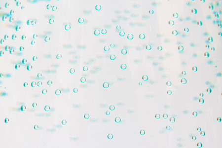 gas bubbles in a bottle of mineral water.の写真素材