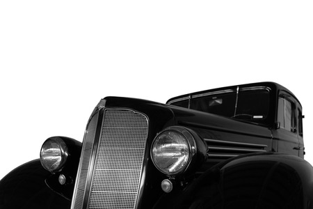 Vintage, black, shiny car on white background.の写真素材