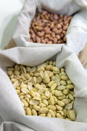 Peanuts in a jute bag.の写真素材