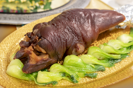Pork leg baked with greens.の写真素材