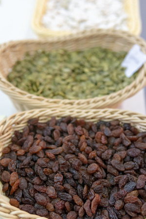 Brown raisins in a basket.の写真素材