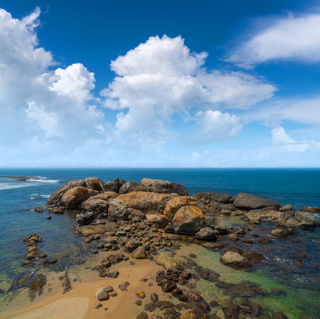 Large rocks in the ocean near the shore.の写真素材