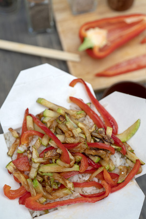 Asian white rice with vegetables in a paper box.の写真素材