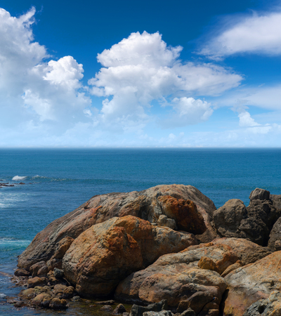Large rocks in the ocean near the shore.の写真素材