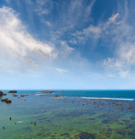 Large rocks in the ocean near the shore.の写真素材