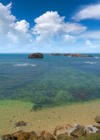 Large rocks in the ocean near the shore.の写真素材
